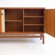 Buffet Ilmari Tapiovaara in teak with fabric and brass details.