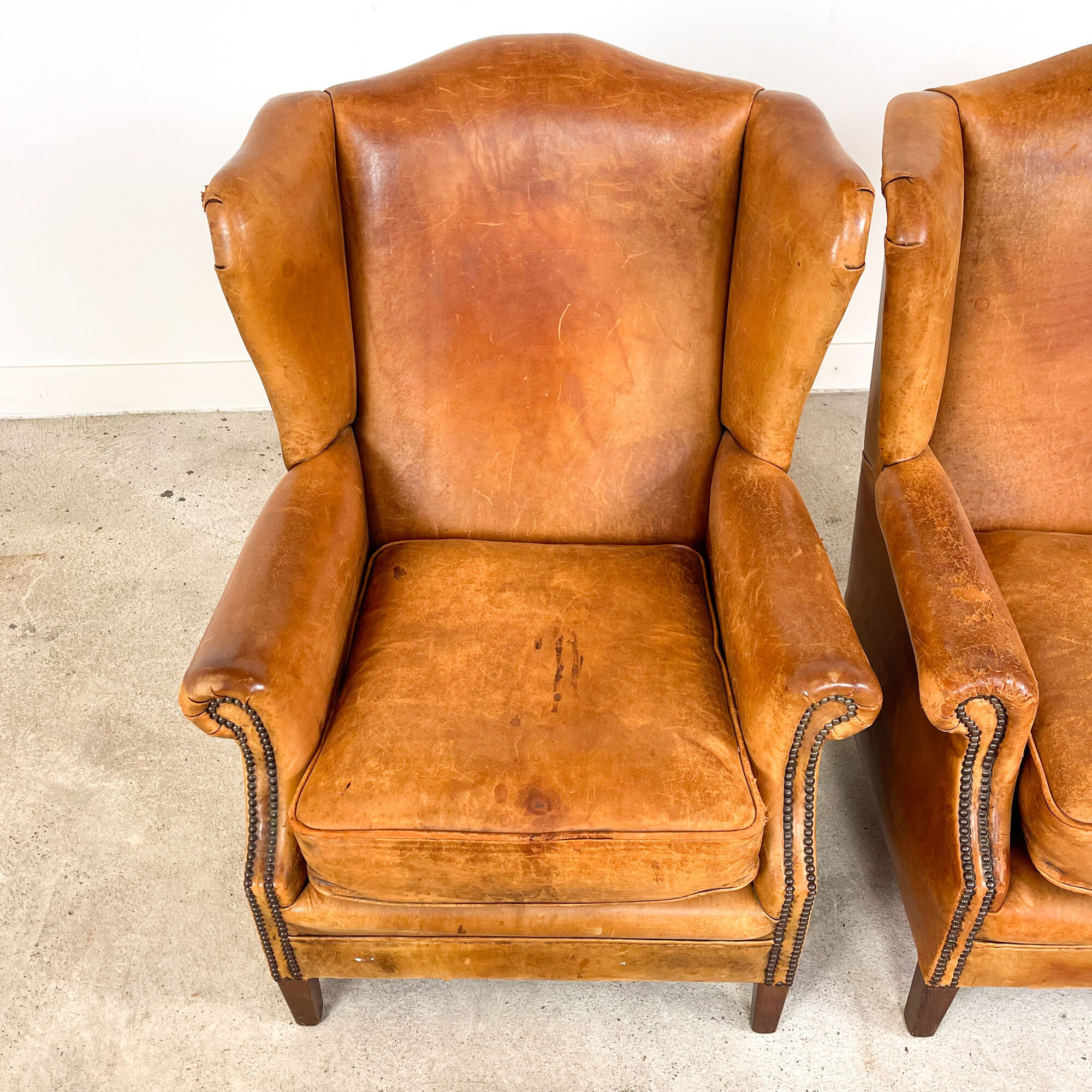 Set of two sheep leather wingback armchairs Delft