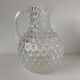 Beautiful and large vintage glass jug with a handle, made of clear hot-worked glass.