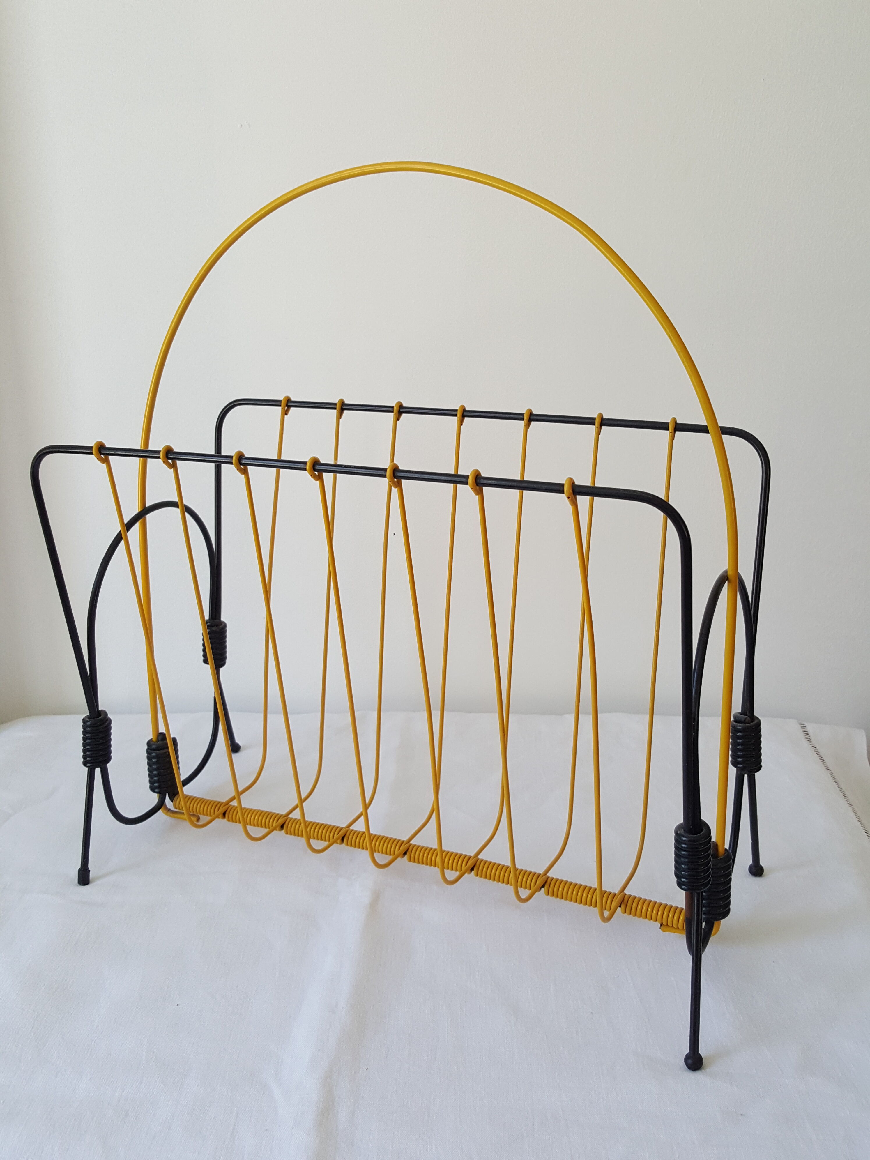 Black and yellow metal magazine holder 70s