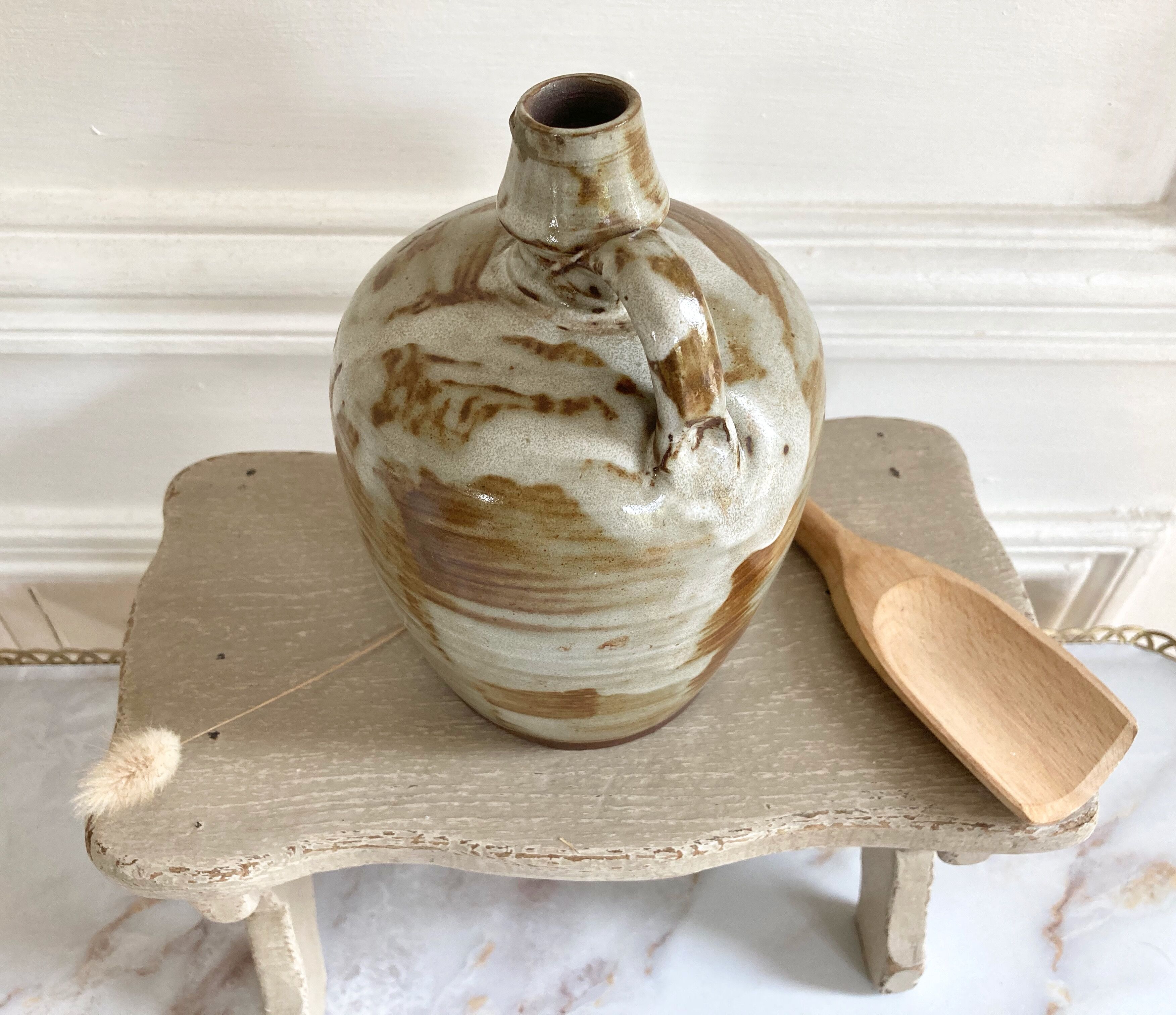 Set of three glazed ceramic pitchers