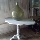 Reclining gray patinated oval pedestal table