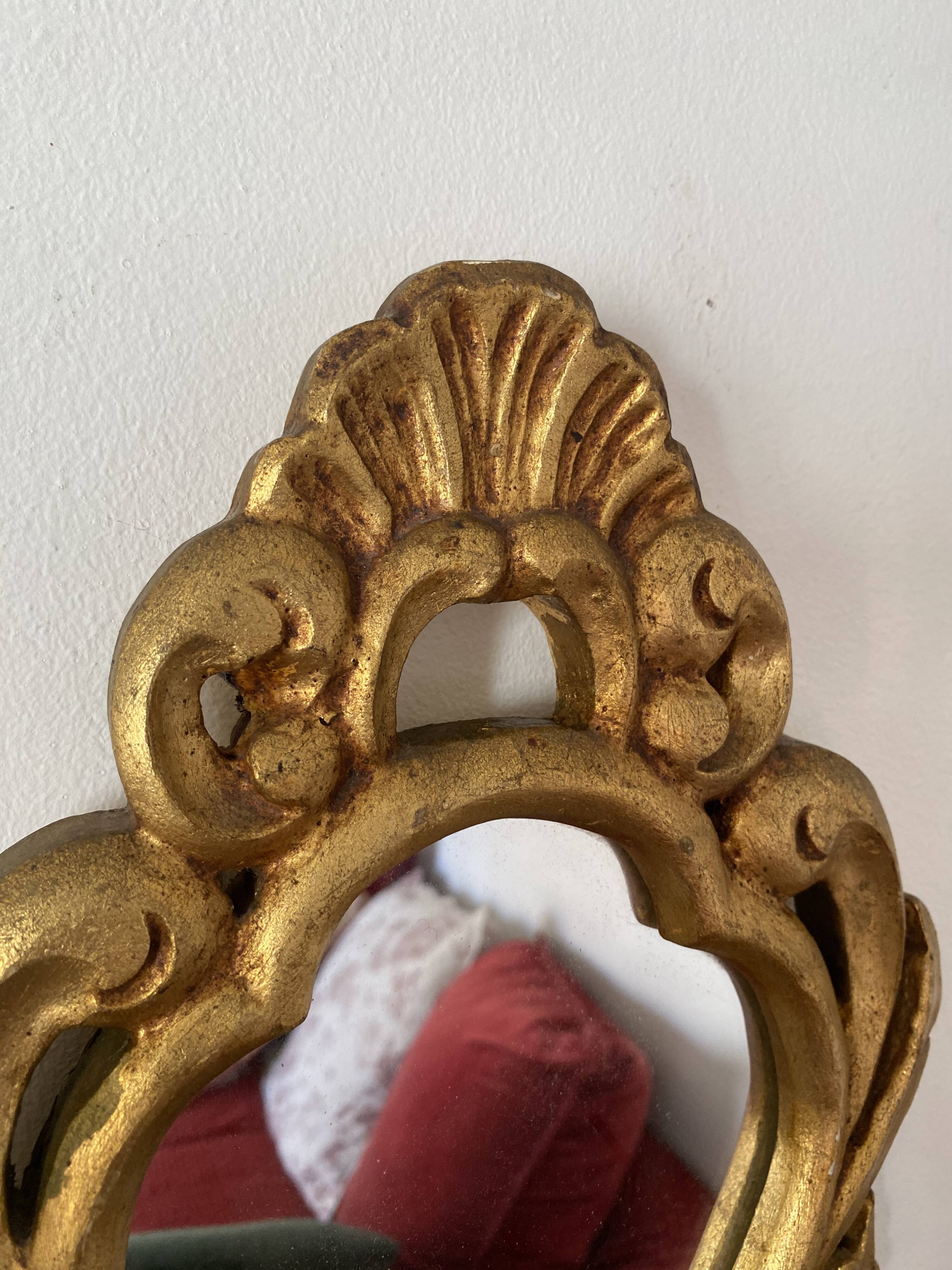 Golden mirror in baroque style.