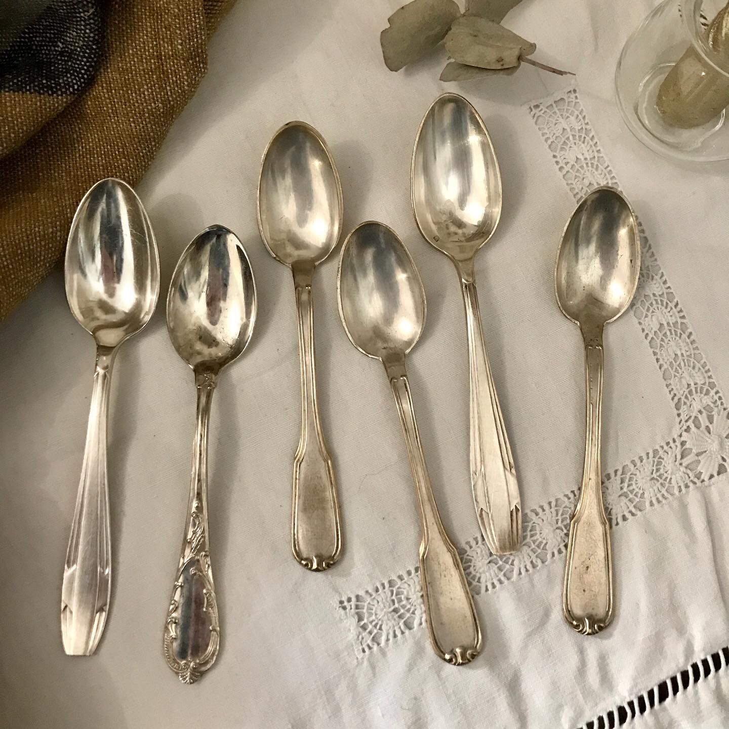 6 mismatched silver spoons