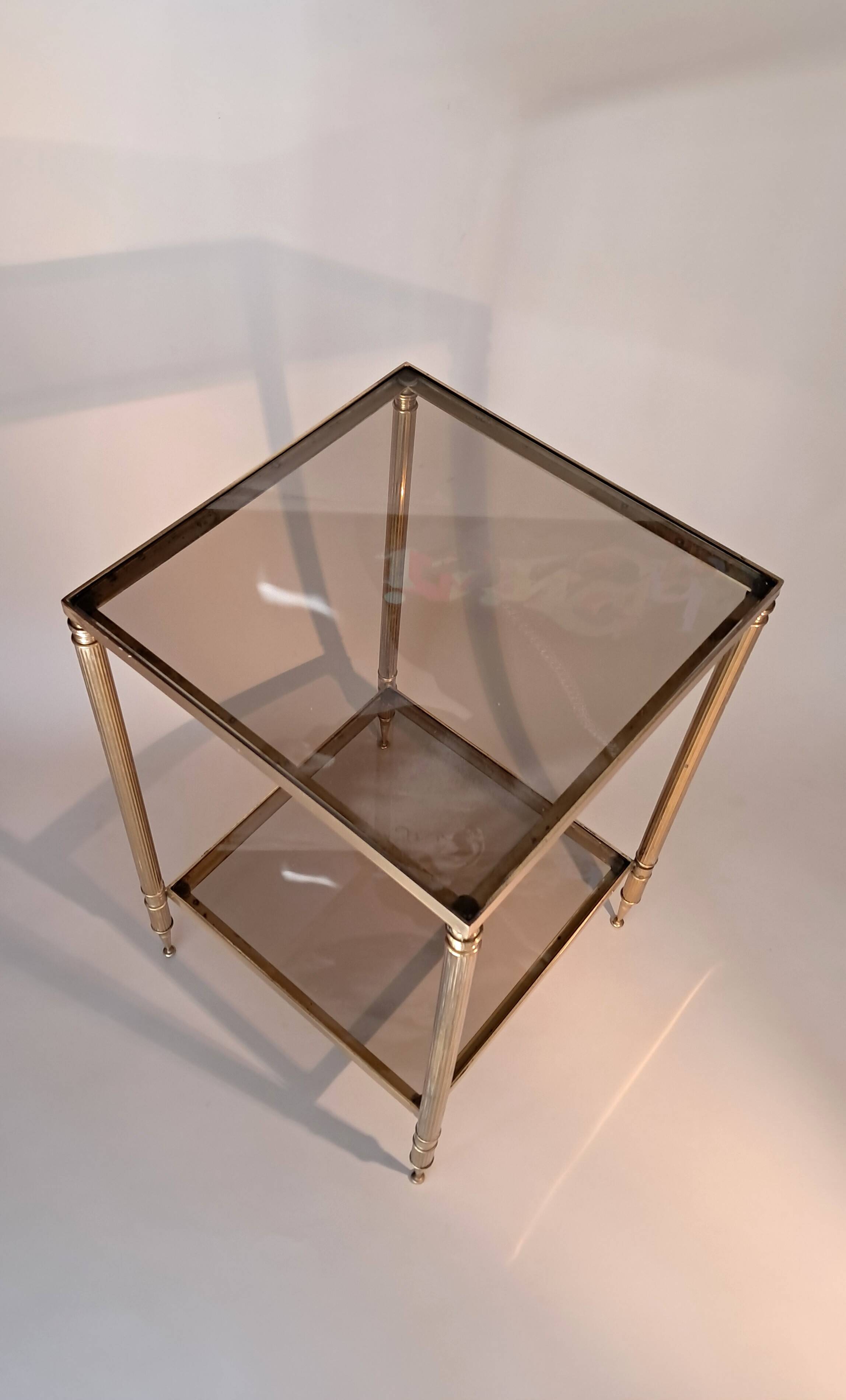 Gilded brass and smoked glass end table, 1960s.