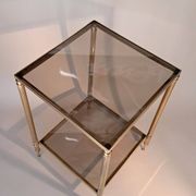 Gilded brass and smoked glass end table, 1960s.