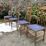 4 vintage Roche Bobois chairs from the 80s in beech with woven seats in blue fabric.