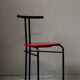 Set of 4 vintage black metal chairs with red lacquered seats.