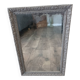 Antique mirror in carved, painted and patinated wood