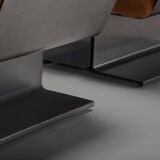 Very rare pair of leather and steel lounge chairs by Paul Geoffroy for Uginox