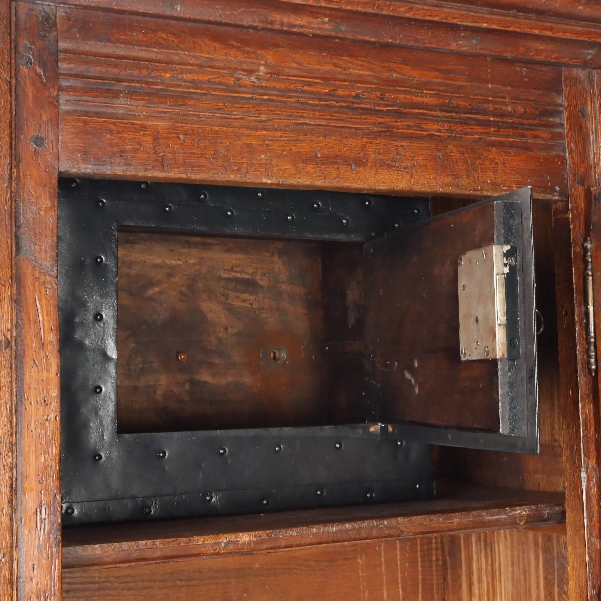 Antique baroque wardrobe in oak with safe, Italy, late 19th century.