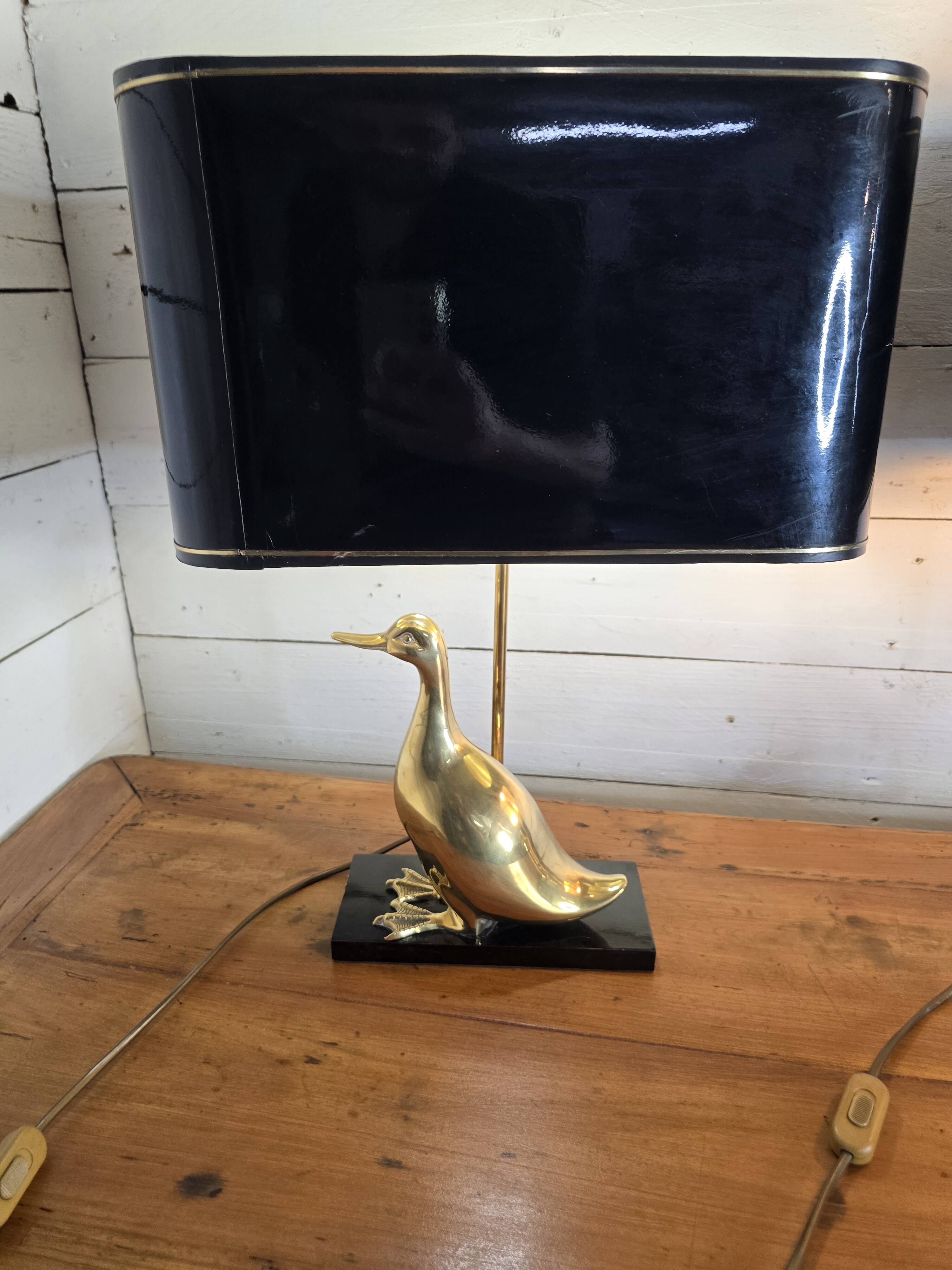 Pair of 70s table lamps featuring a brass duck