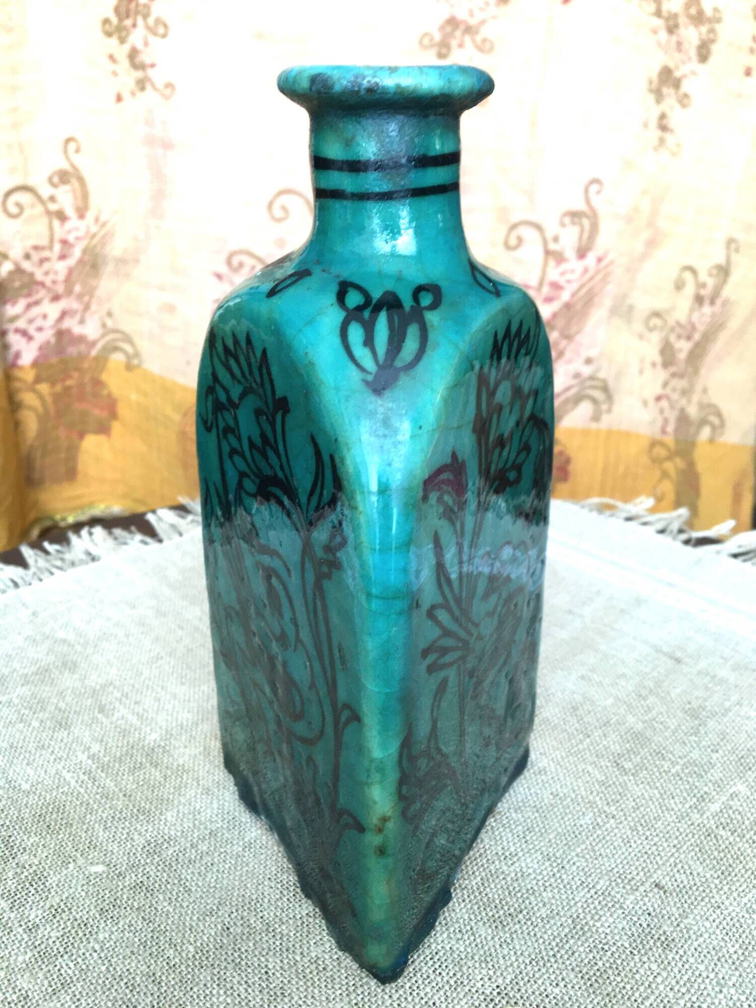 Antique Iranian three-sided blue ceramic bottle