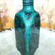 Antique Iranian three-sided blue ceramic bottle