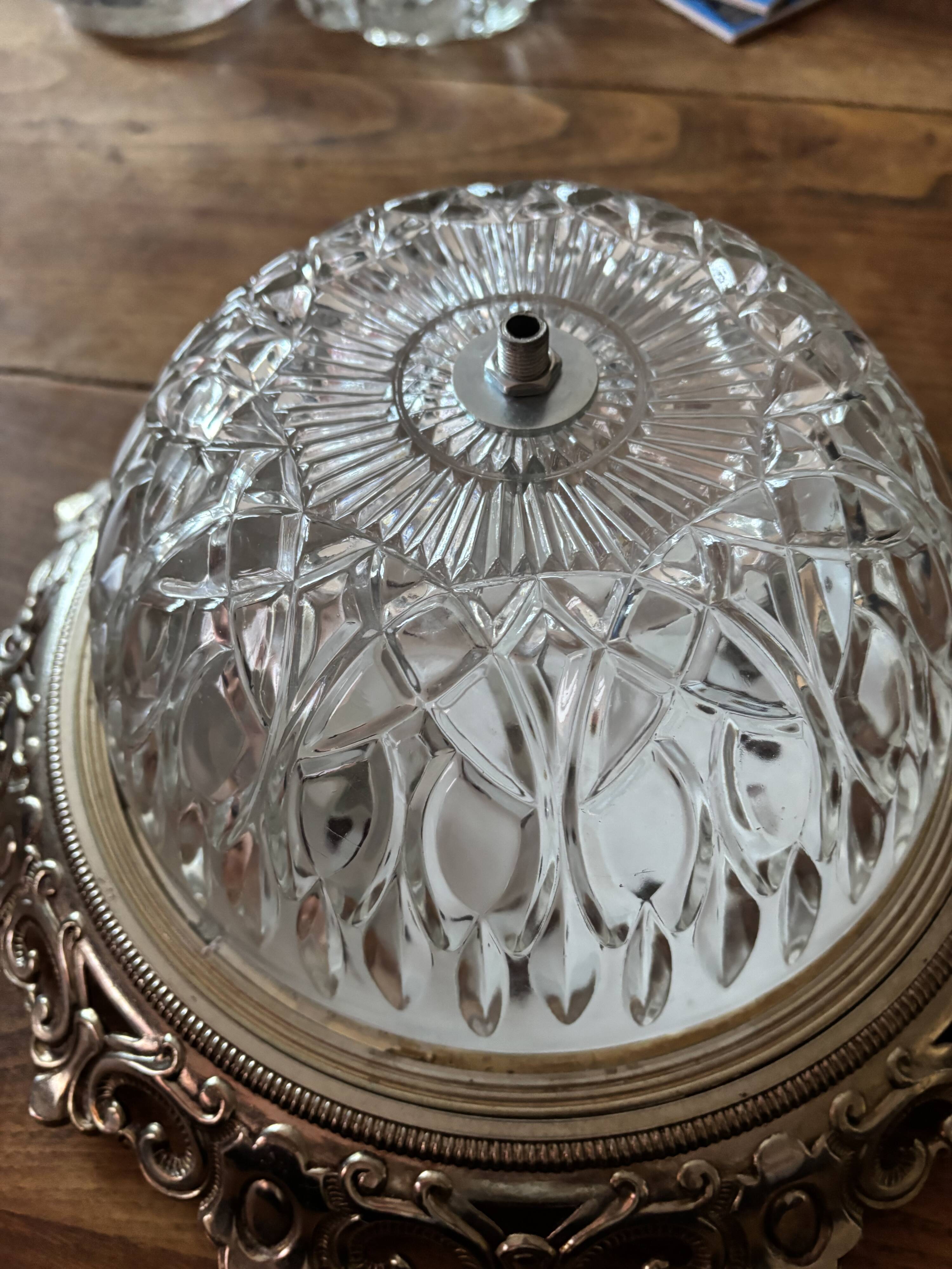 Gold ceiling light with chiseled glass globe