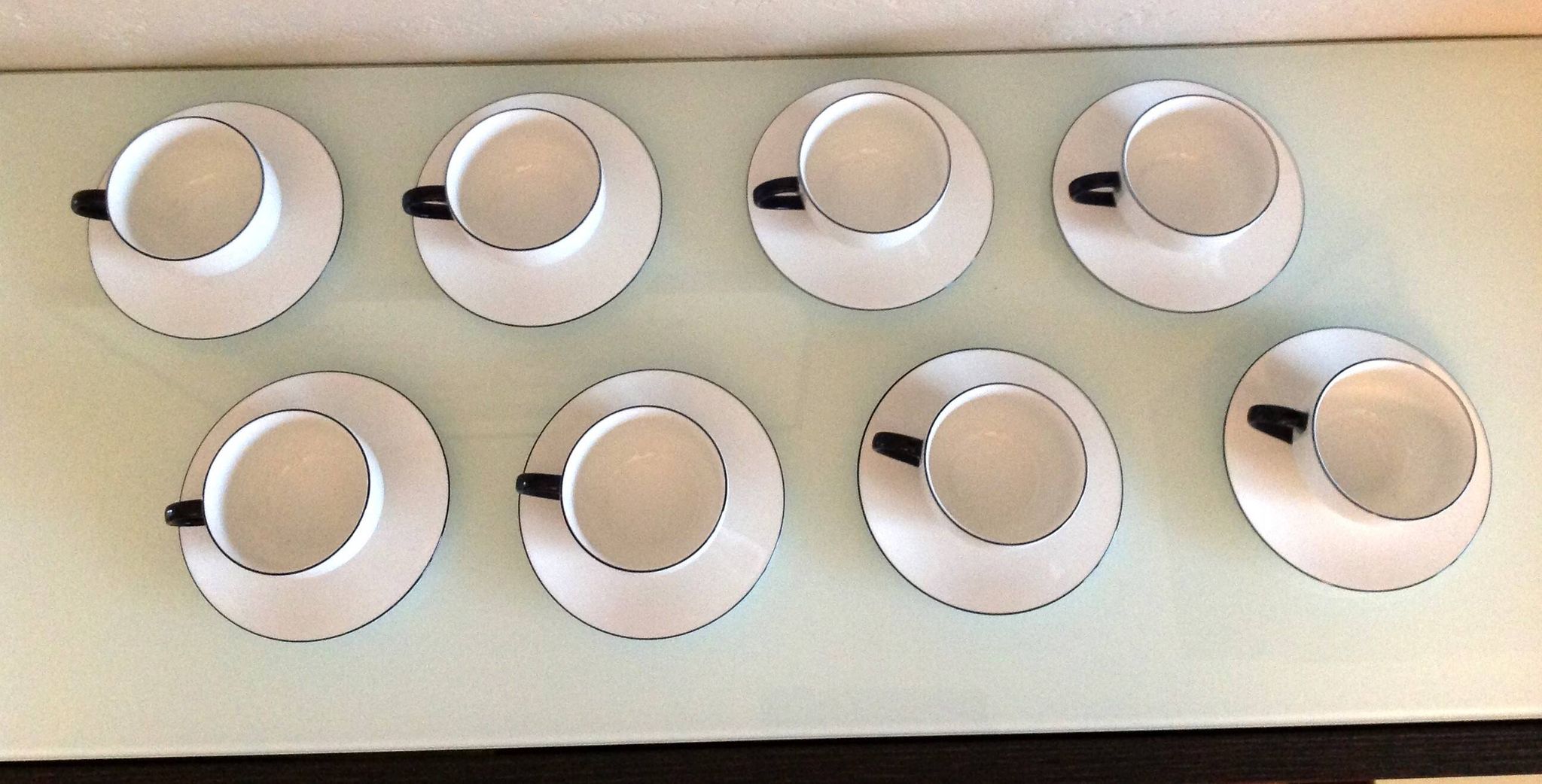 Set of eight white porcelain cups with blue edging / vintage 70s-80s
