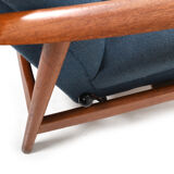 Pair of mid century Danish reclining lounge chairs in teak