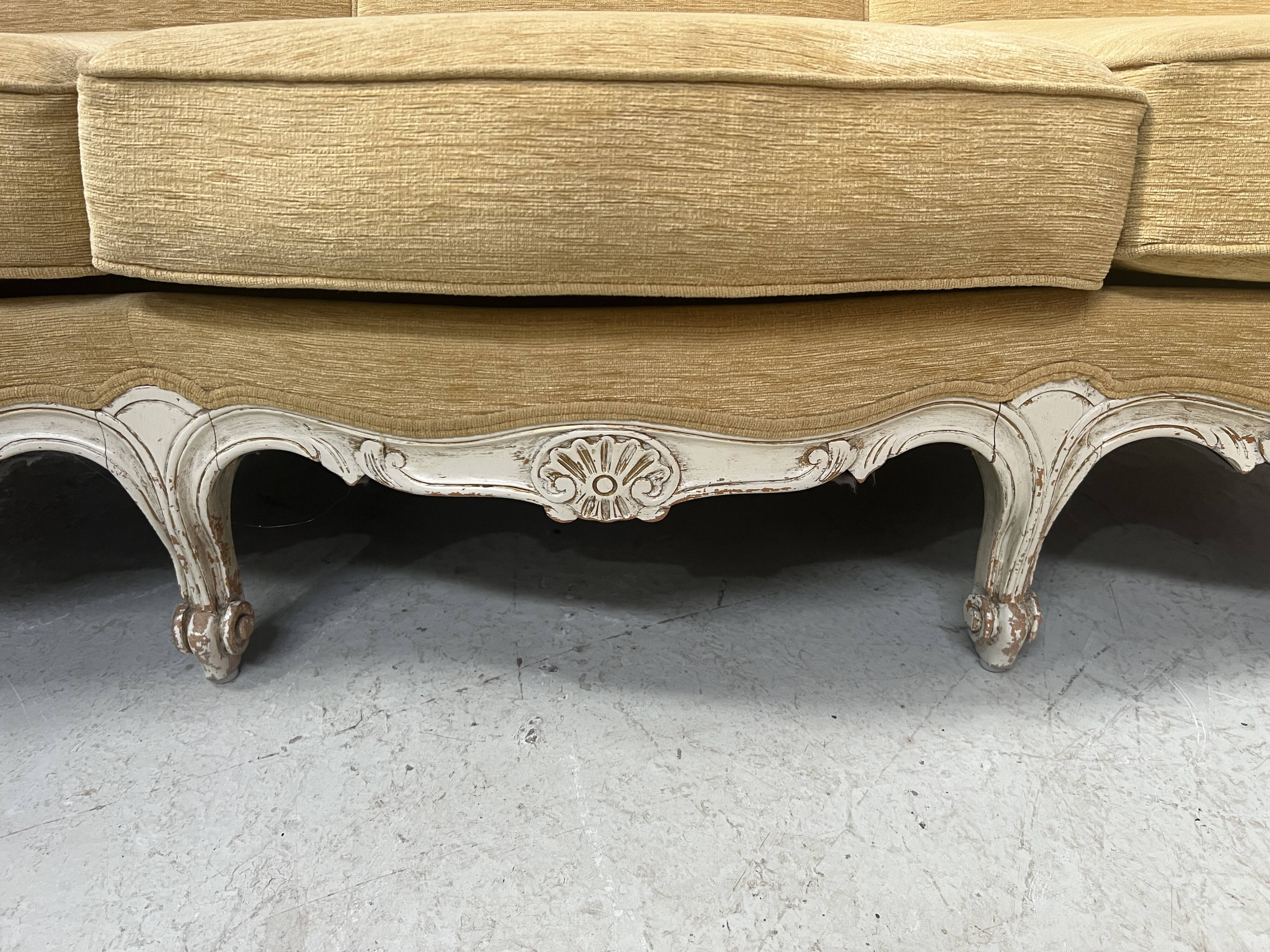 Louis XV style three-seater wingback sofa in patinated beech, 20th century