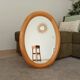Vintage oval mirror in beech from the 70s/80s.