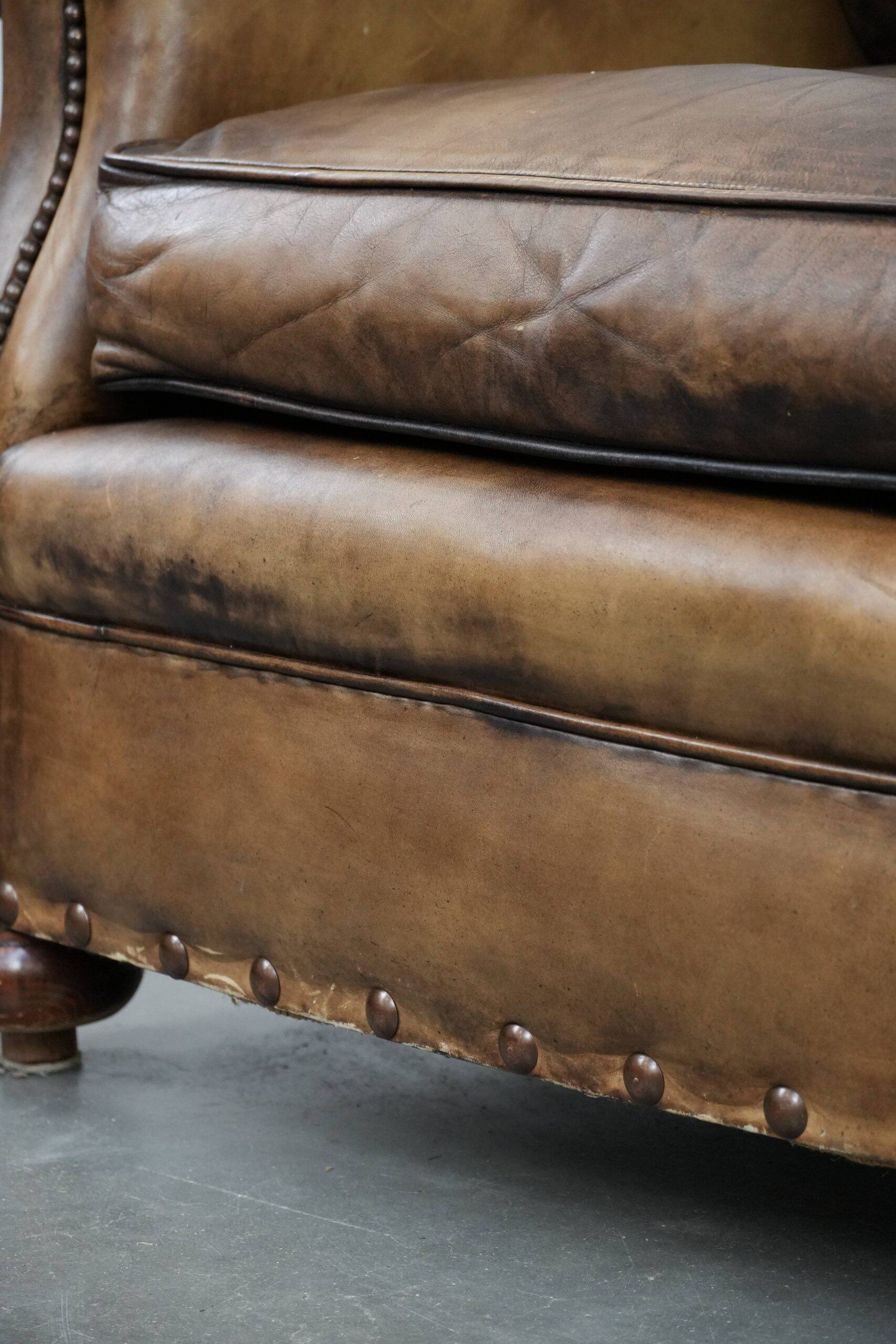 Luxury and large cowhide leather wingback chair in English style