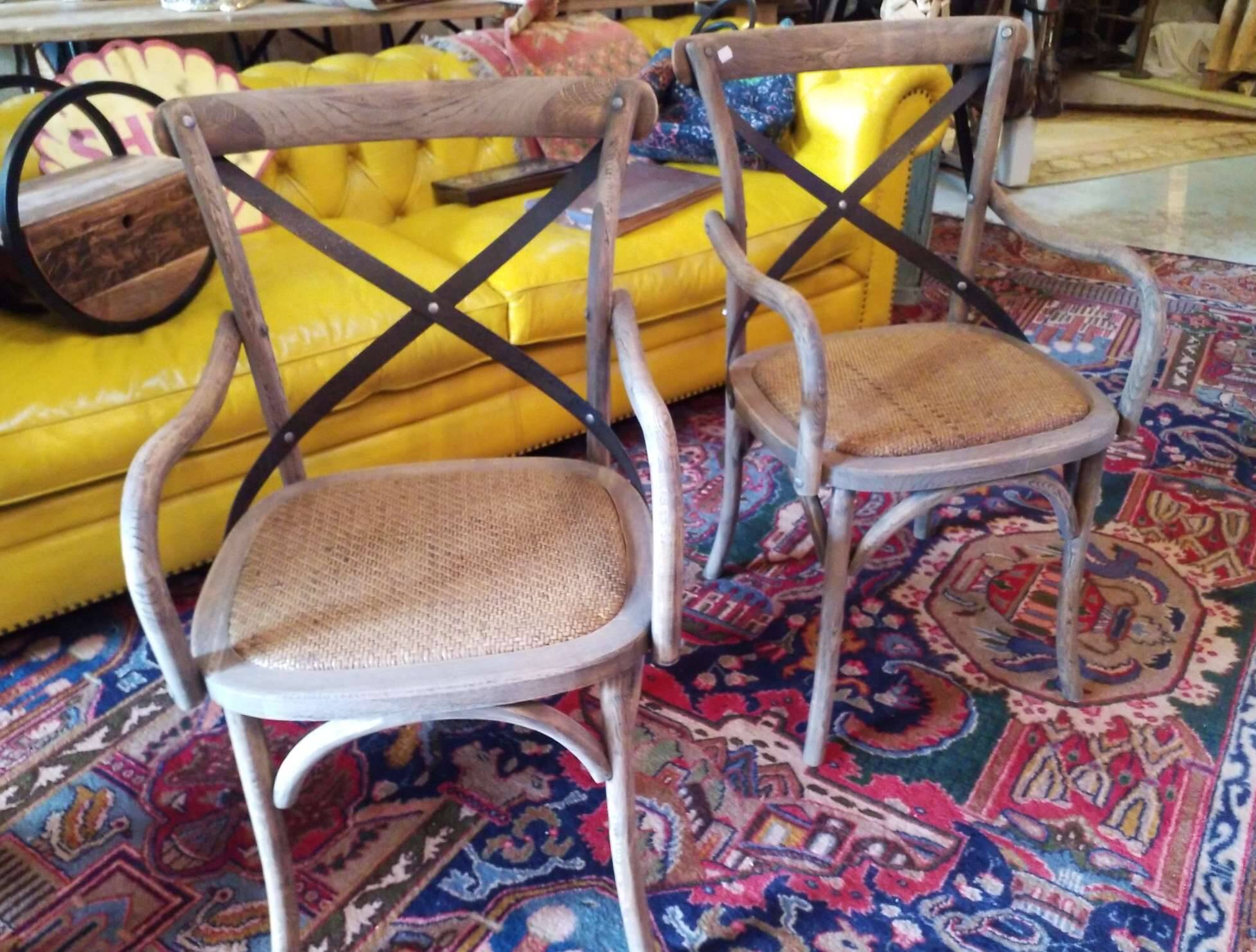 Angled wooden armchairs