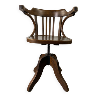 Baumann rotating armchair in vintage wood