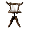 Baumann rotating armchair in vintage wood