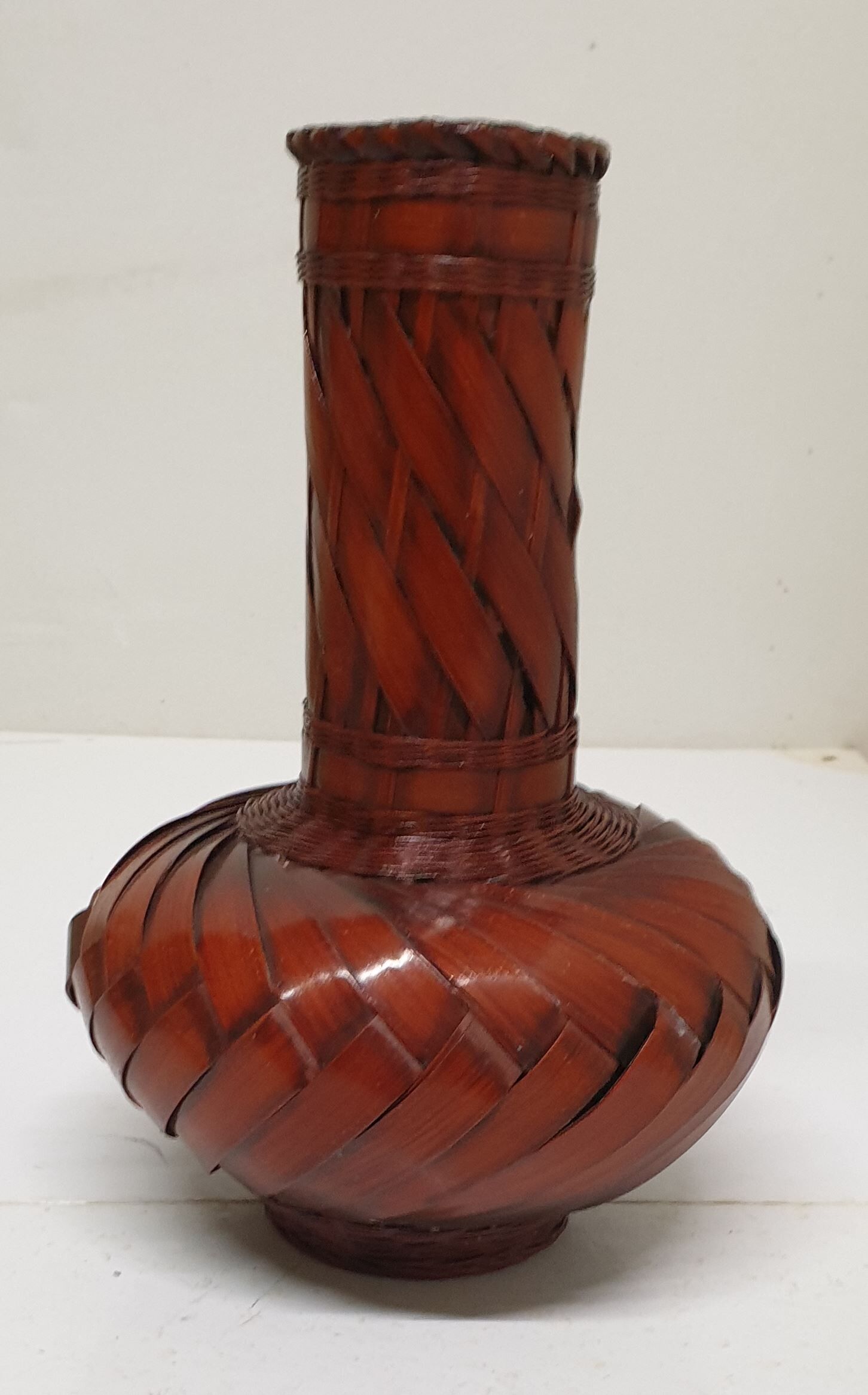 Vase made of braided bamboo leaves