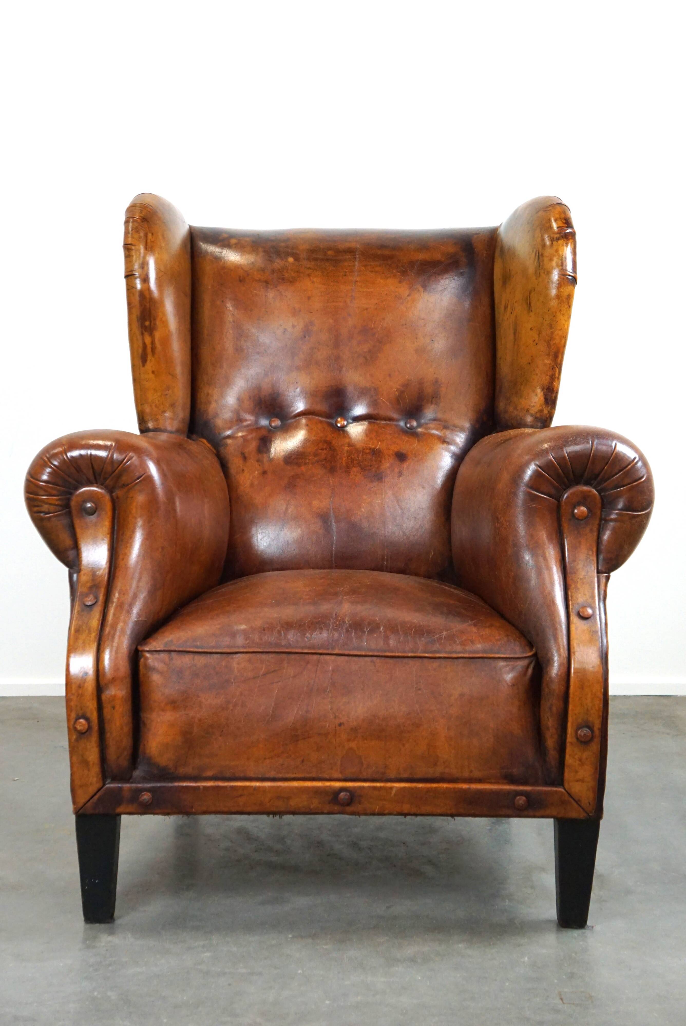 Irresistible old sheep leather wingback armchair with the most beautiful colors
