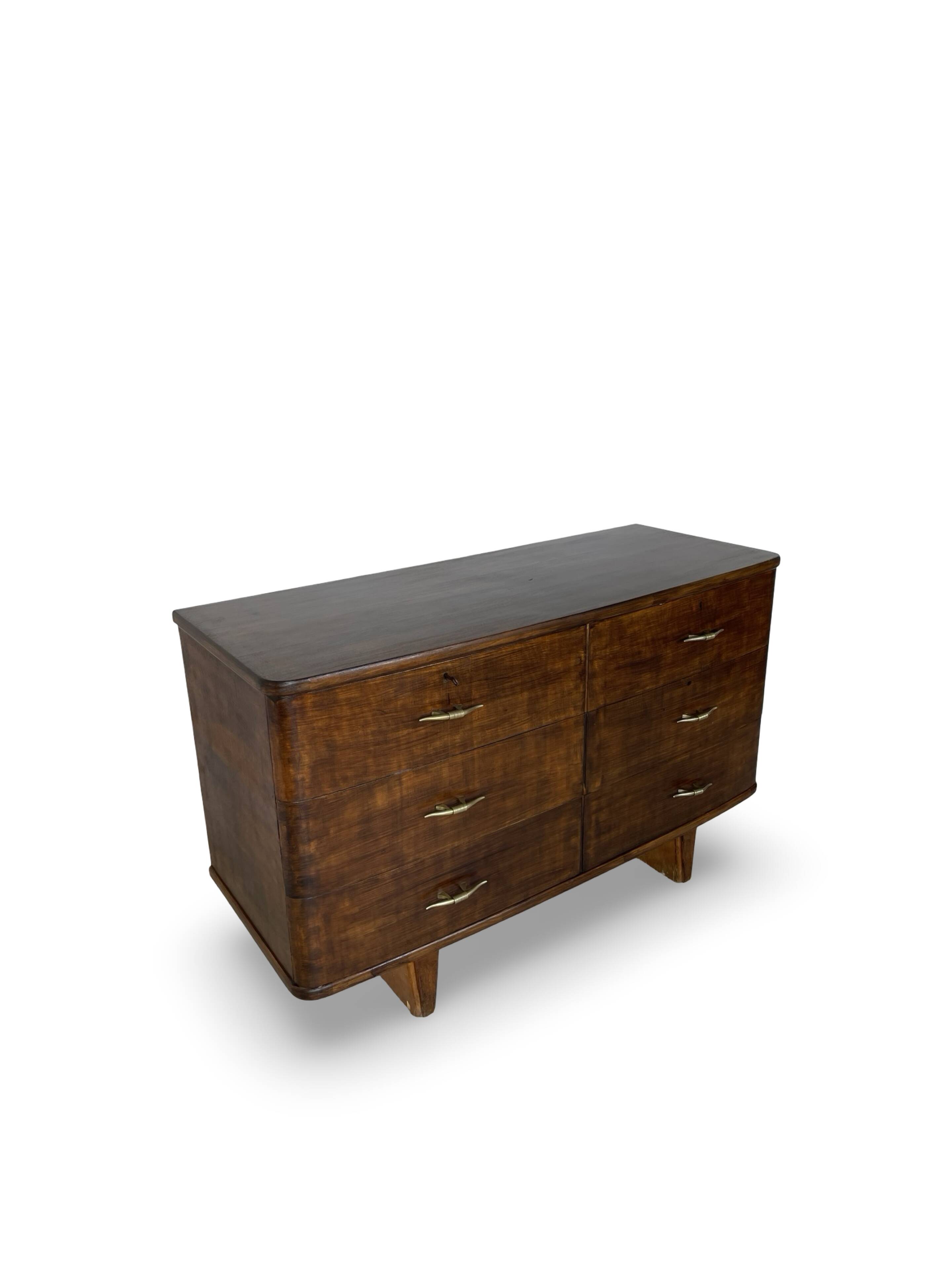 A vintage Italian chest of drawers, made of veneered walnut and solid wood,