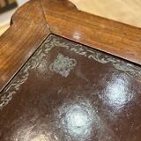 Classic nesting tables in wood and leather.