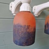 Pair of Art Deco wall sconces in multicoloured porcelain and frosted glass.