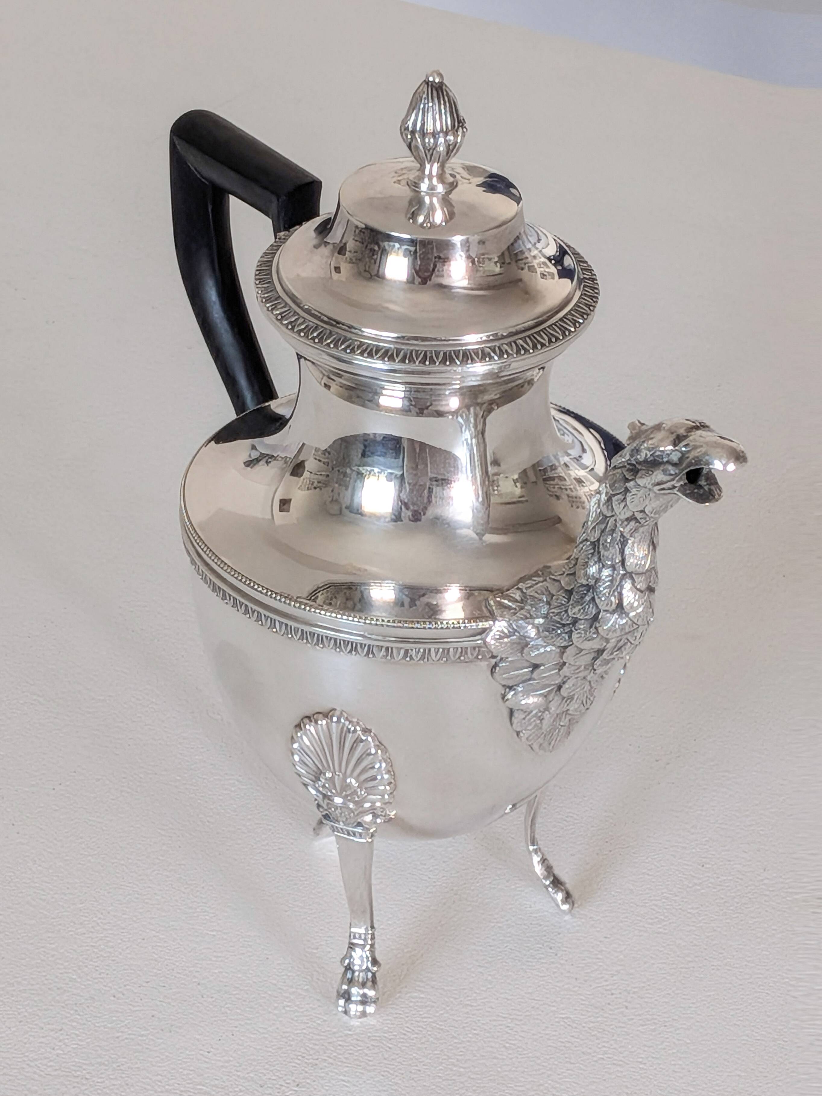 Empire-style silver-plated coffee pot with eagle head spout.