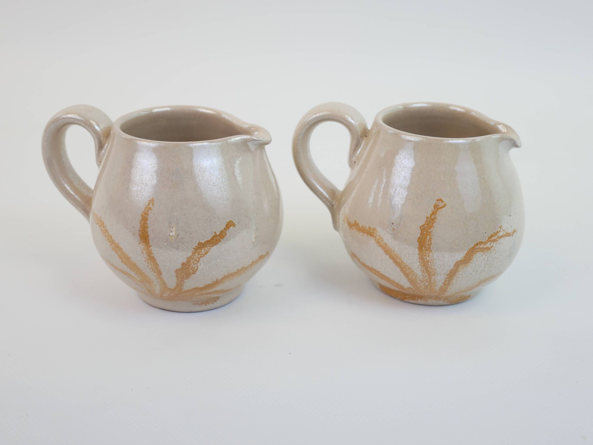 Pair of ceramic milk jugs signed La Roue Vallauris