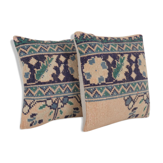 Set of two muted ecru carpet rug pillows