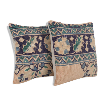 Set of two muted ecru carpet rug pillows