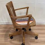 Solid wood swivel and reclining armchair.