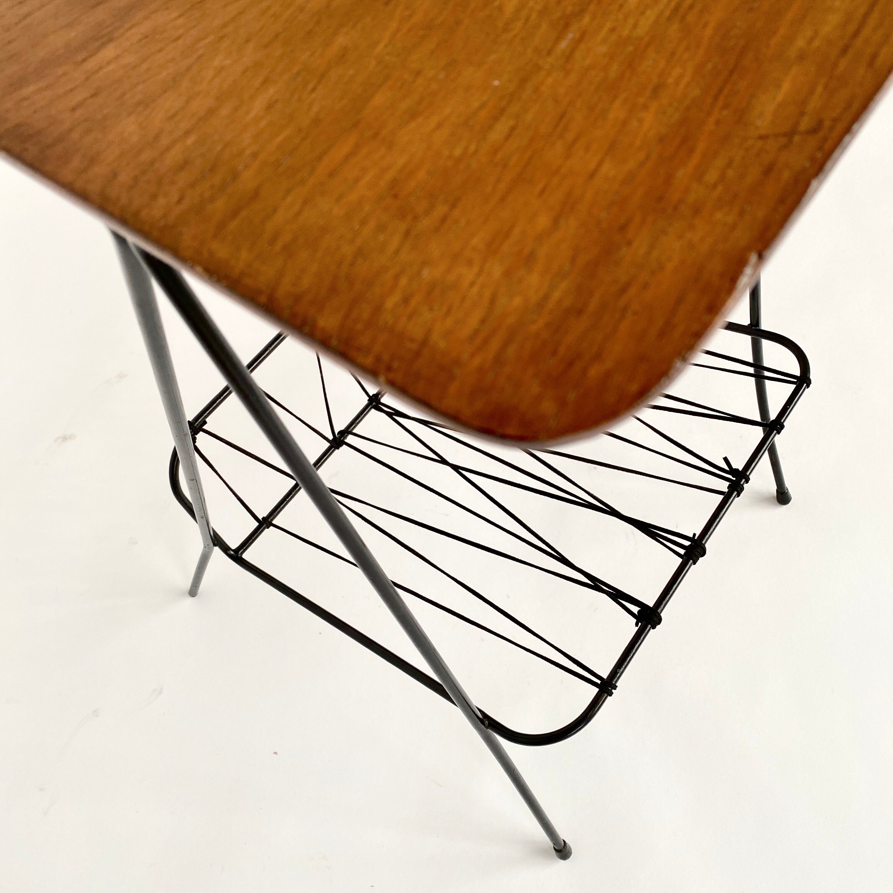 Side table with vintage metal and wood magazine holder