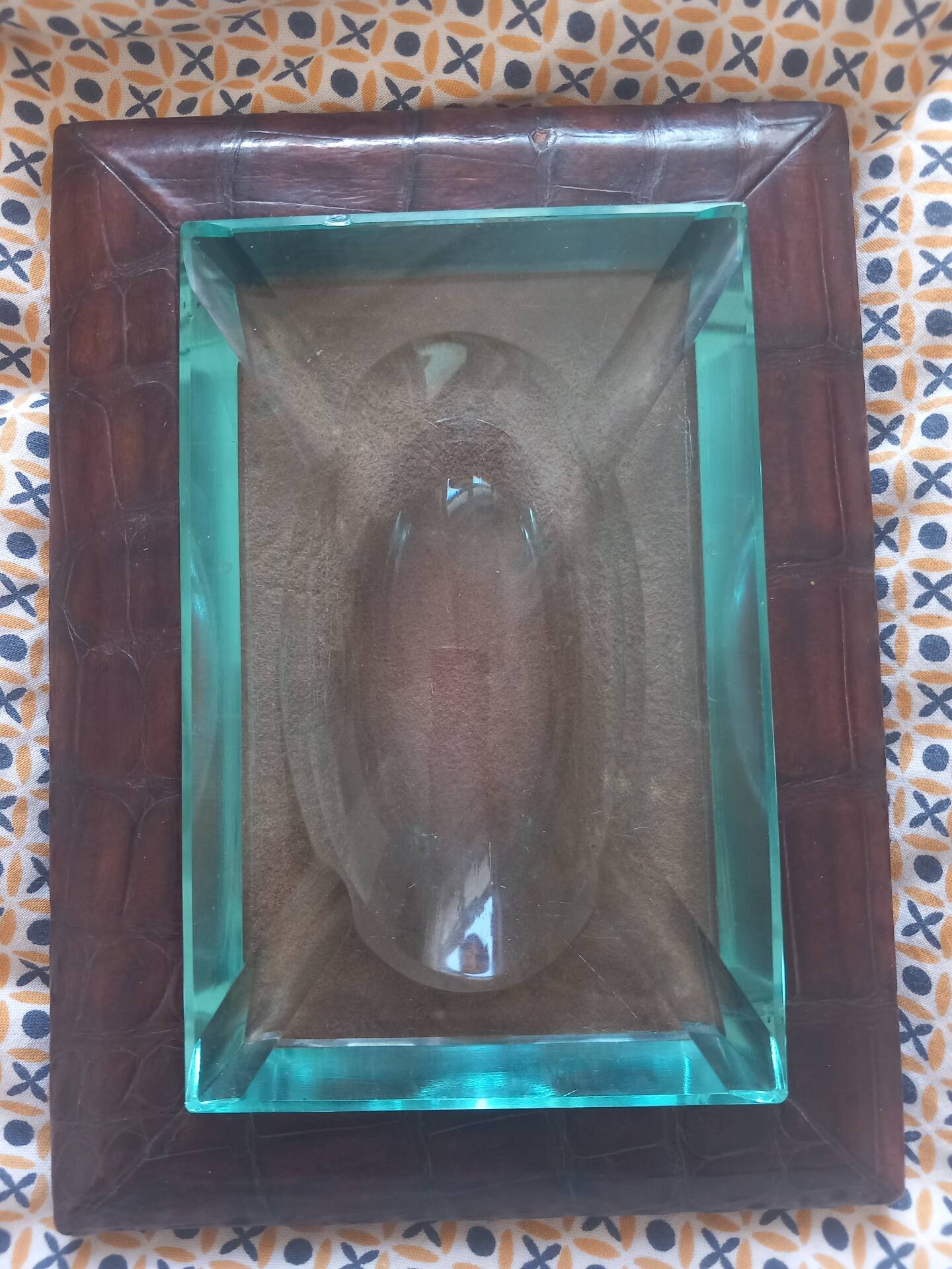 Crocodile leather ashtray with cut crystal.