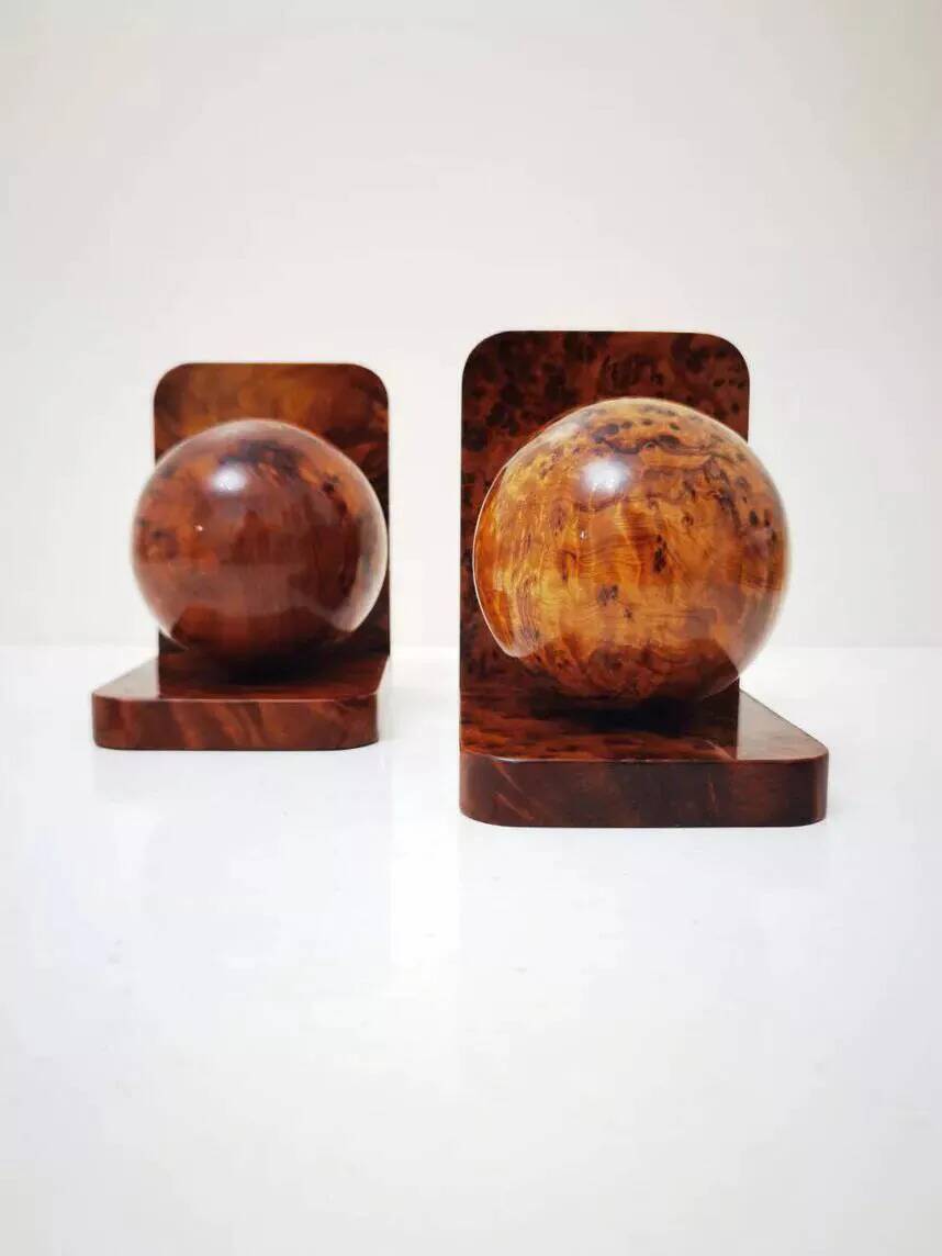 Art Deco bookends made of polished solid burl wood.