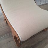 Vintage gondola armchair in beige linen fabric.