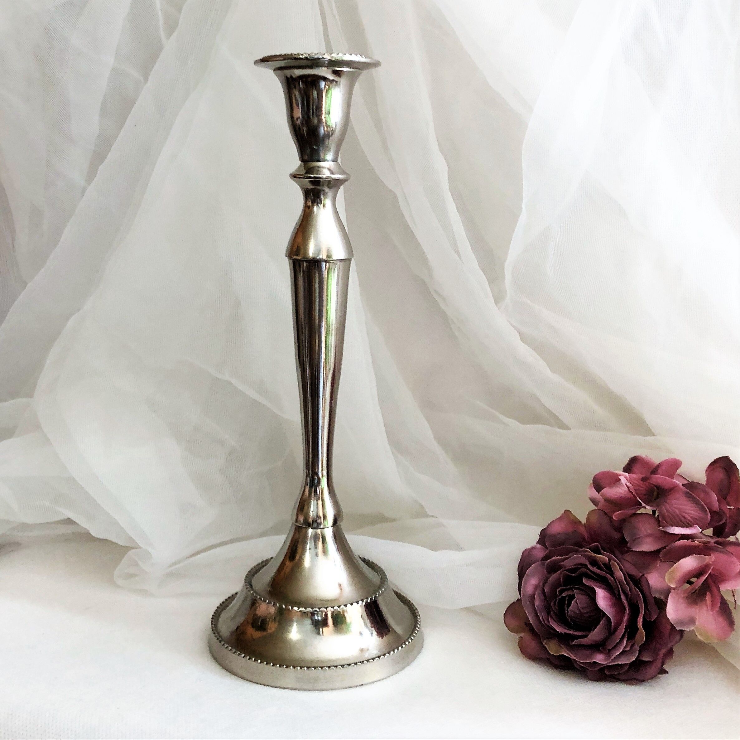Chromed metal candle holder