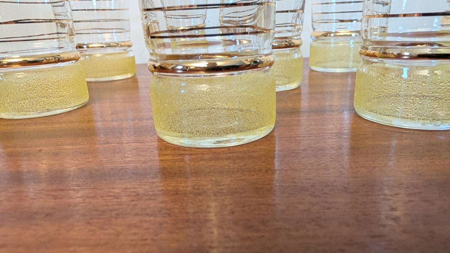 70s vintage glass with gold decoration and a speckled base.