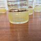 70s vintage glass with gold decoration and a speckled base.