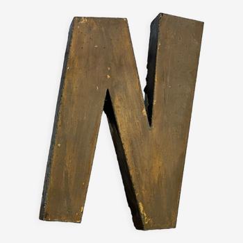 Gold sign letter "N"