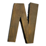 Gold sign letter "N"