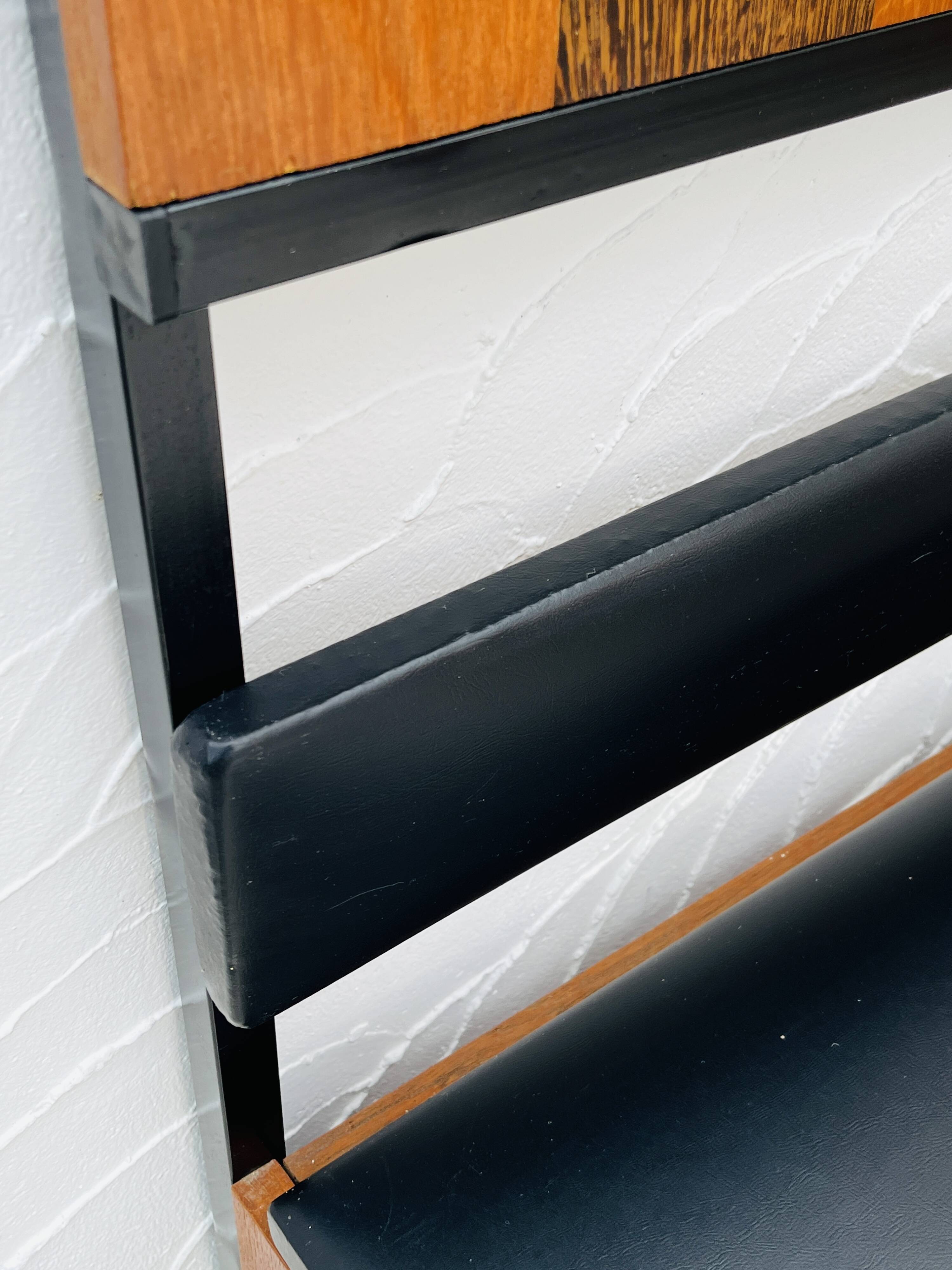 Vintage wall coat rack with storage bench from the 1970s.
