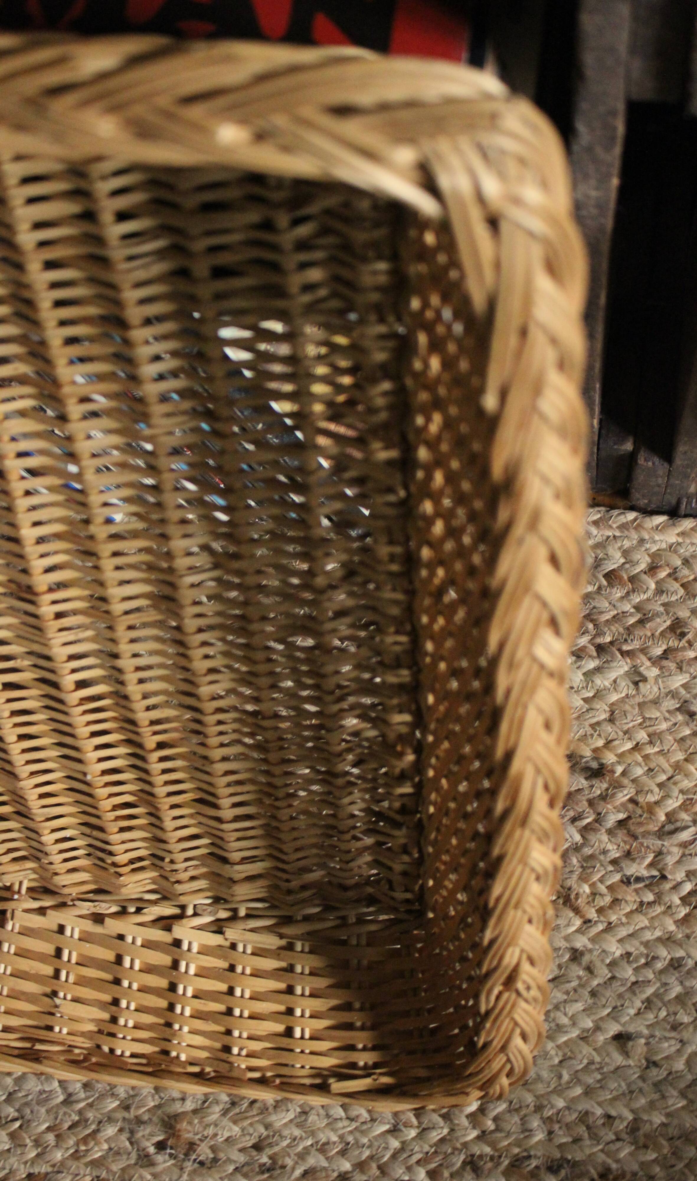 A large vintage rectangular wicker basket