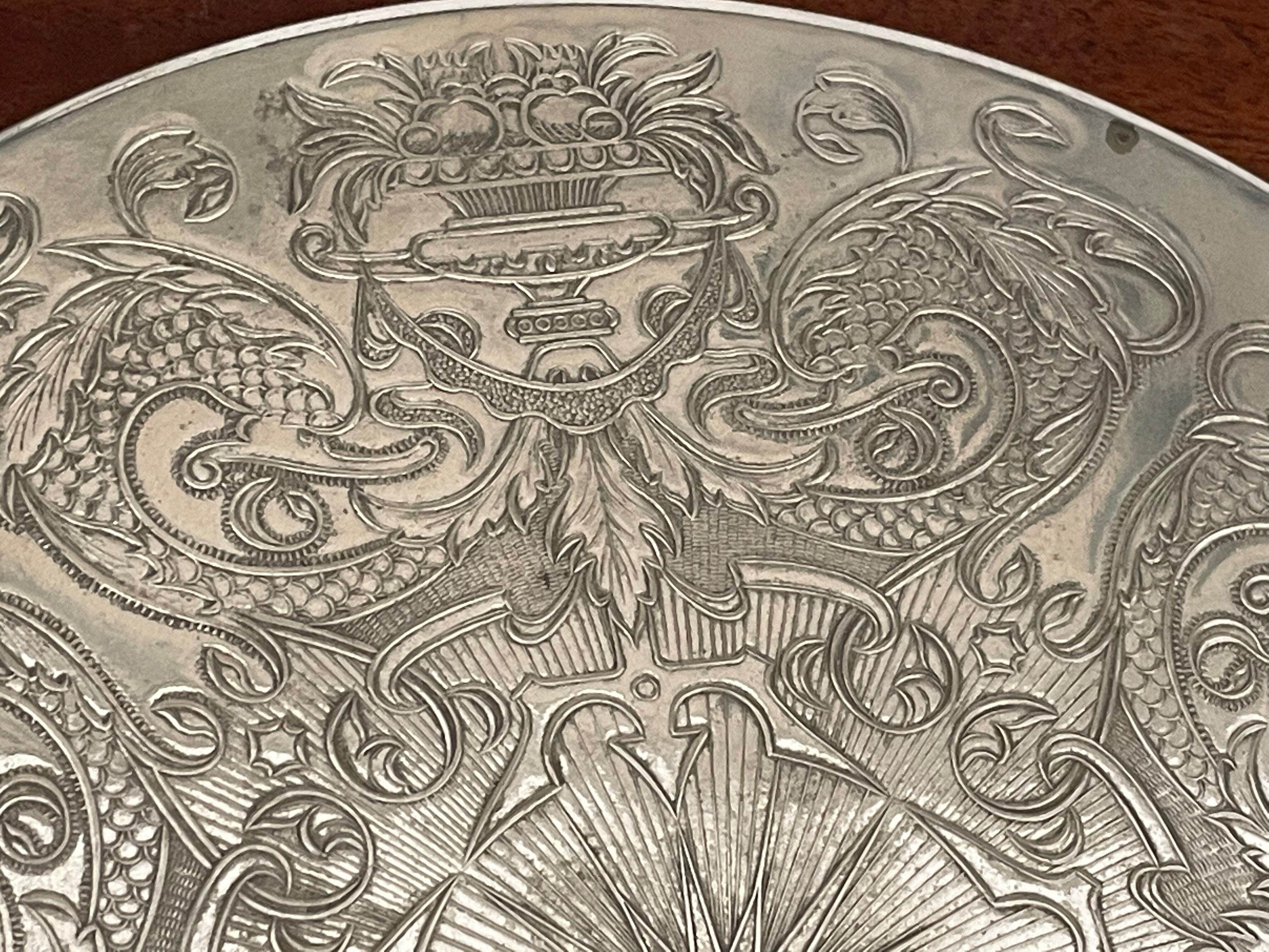 Silvered metal table mat