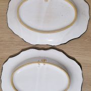 Pair of oval dishes in hand-painted faience with an Italian majolica spirit.